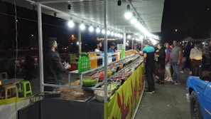 A vibrant display of various dishes served at mobile food stalls.