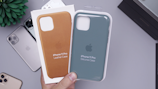 two blue and brown iPhone cases