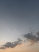 A serene outdoor sky view with soft clouds at sunset.