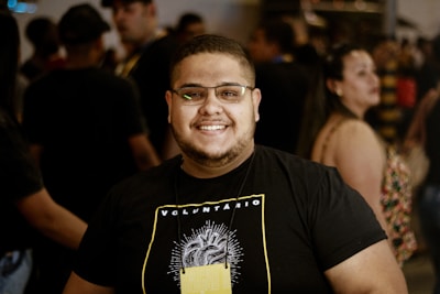 A candid shot of a viral internet star engaging with fans at a public event.