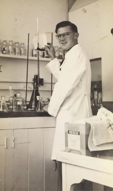 Laboratory technician calibrating analytical equipment in a modern lab setting.
