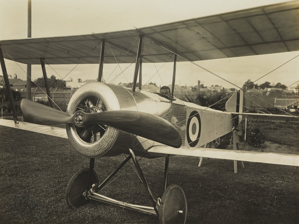 grayscale photography of biplane