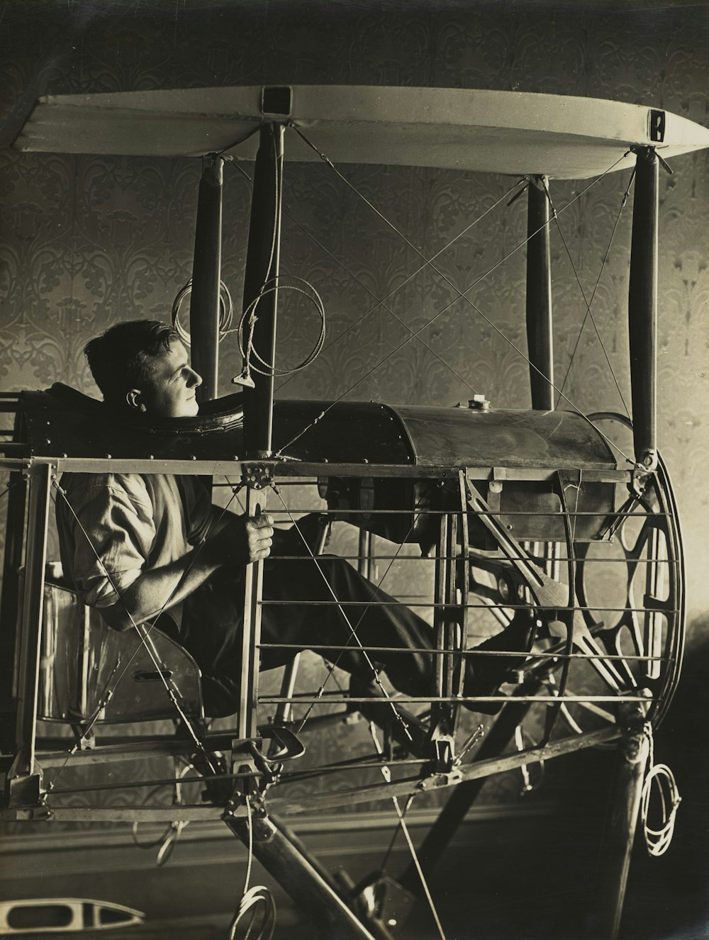 man in plane frame