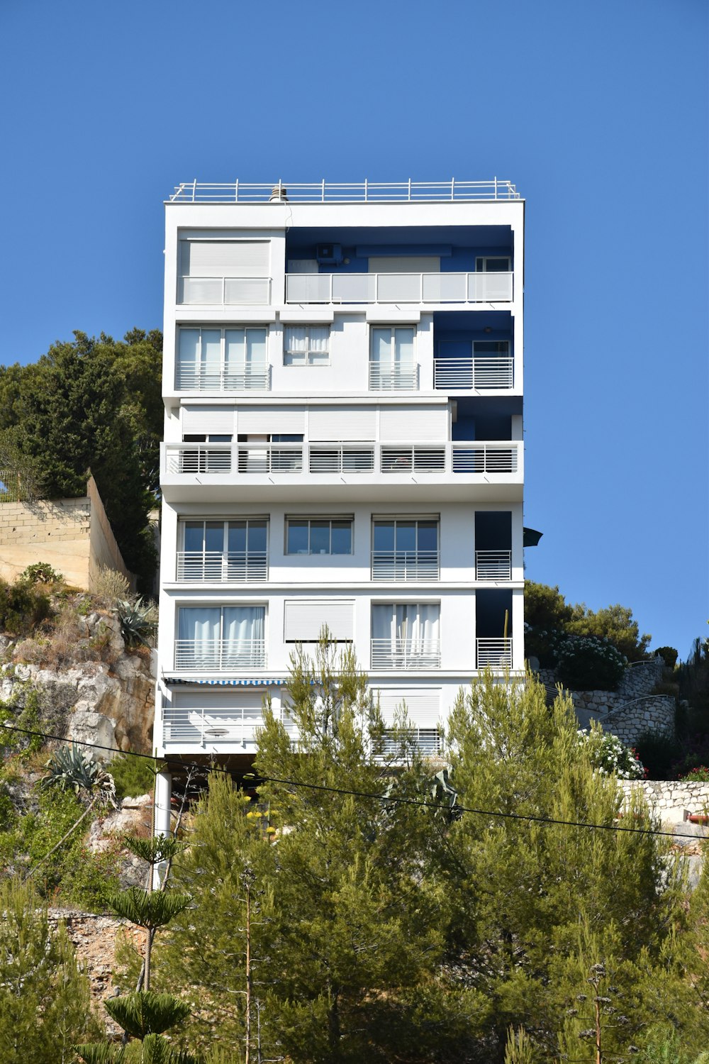 white concrete high-rise building during daytime