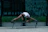 Man stretching outdoors with headphones, looking energized after a benediktastraining session.