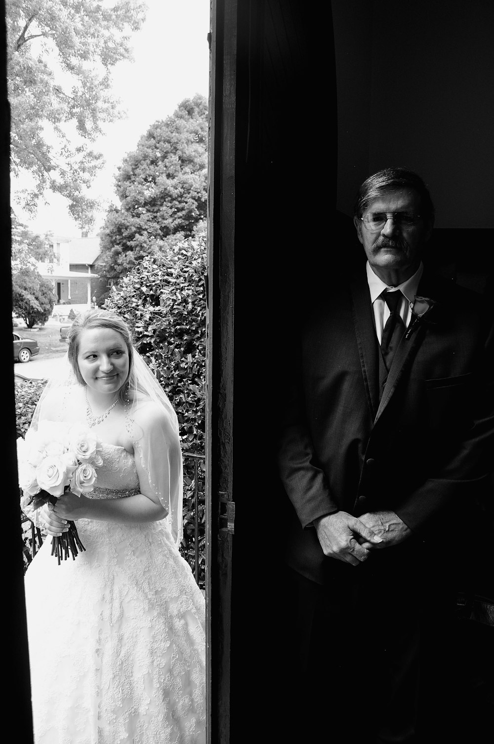 greyscale photography of bride and groom