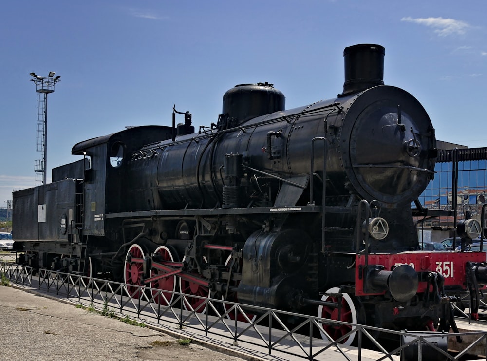 black train under blue skies