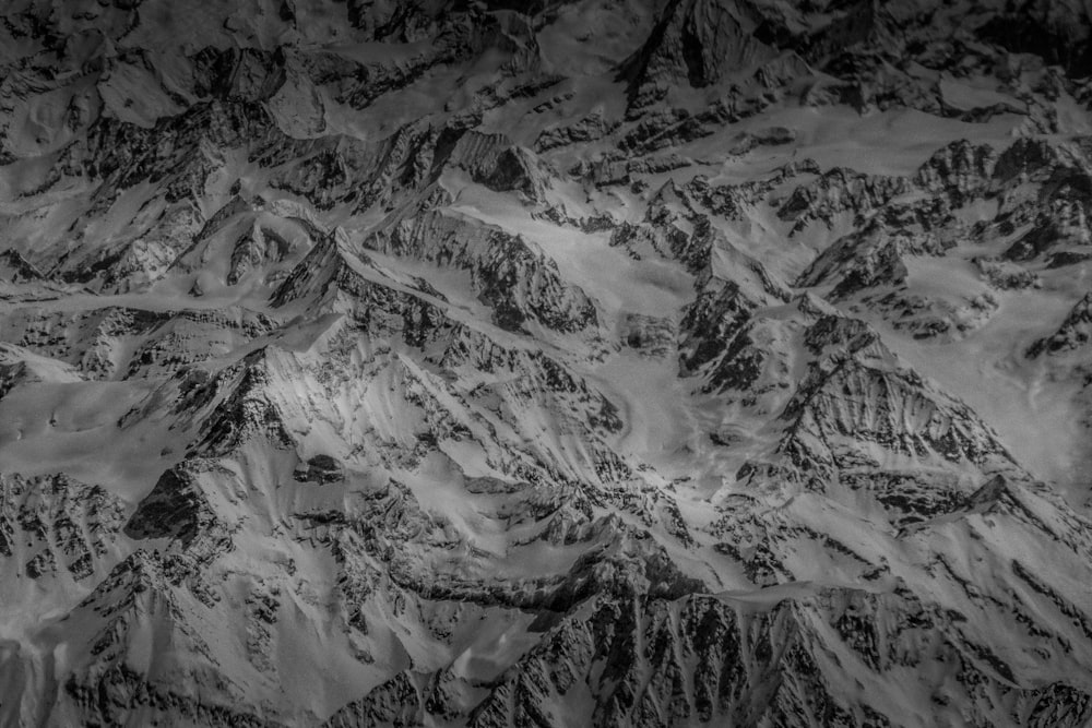 a black and white photo of a mountain range