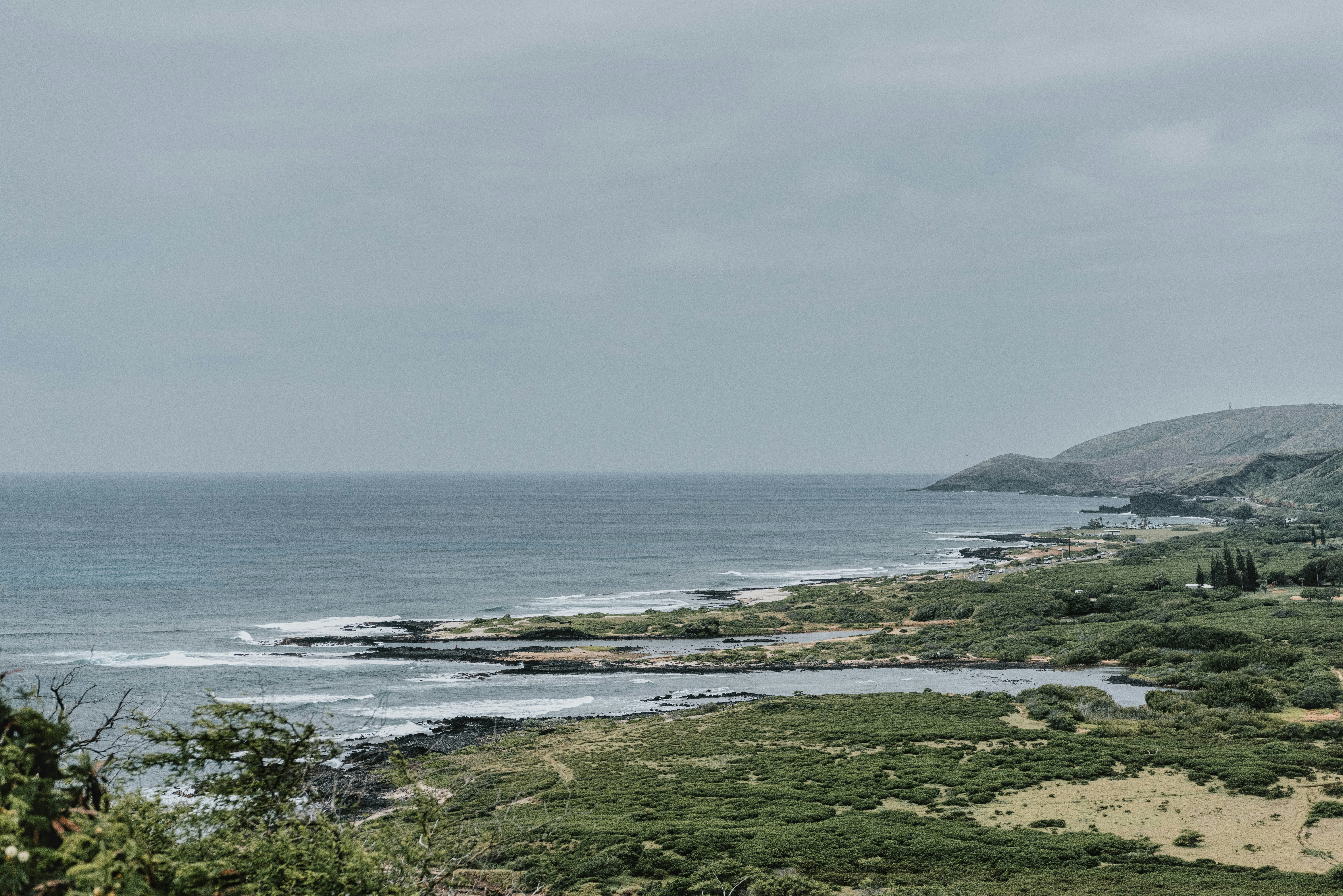 body of water near mountain during daytime, 