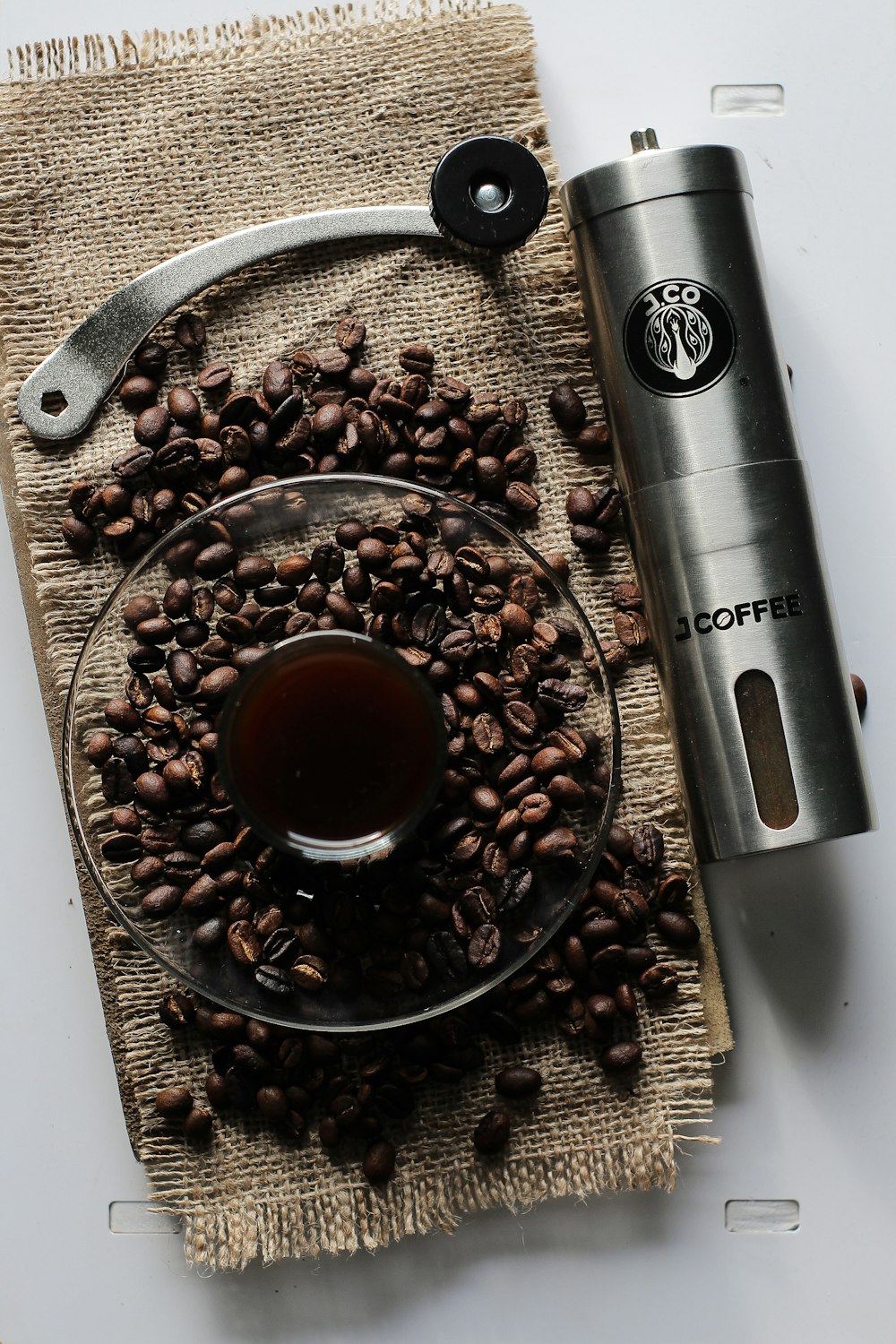 coffee beans and gray portble grinder