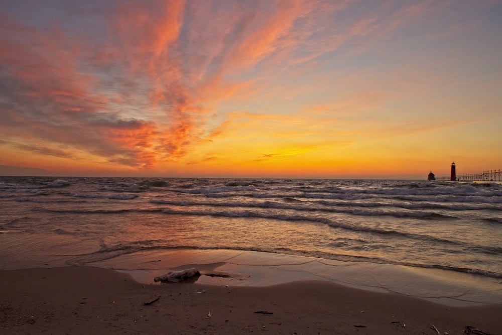 waves rushed to shore during sunset