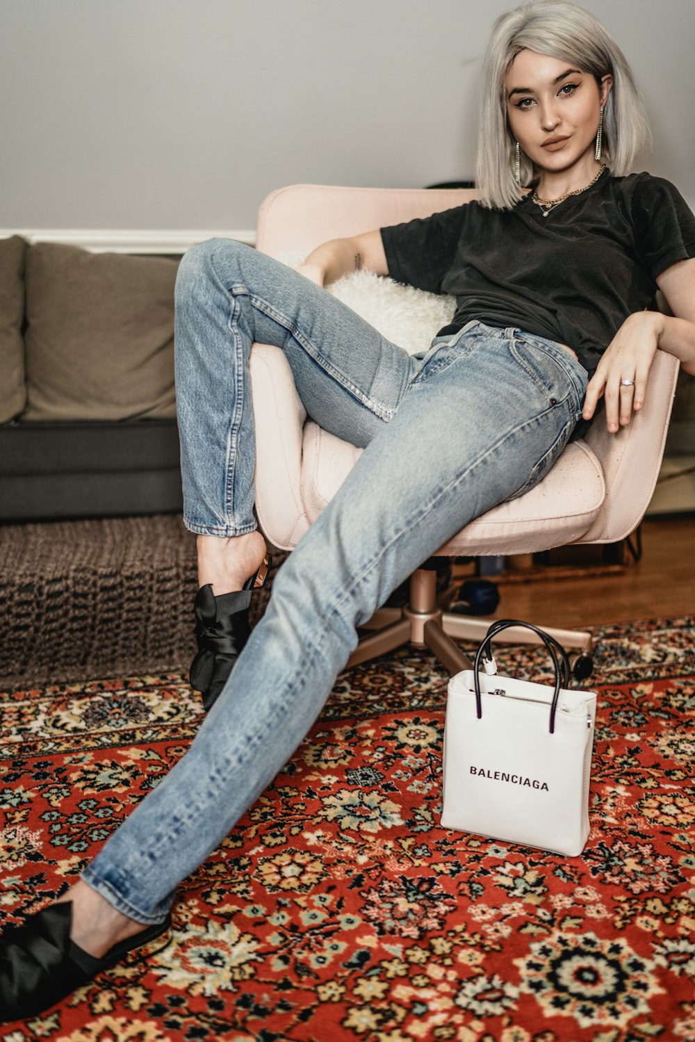 woman sitting on rolling chair