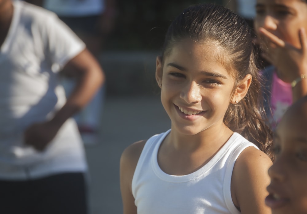 girl wearing white tank top