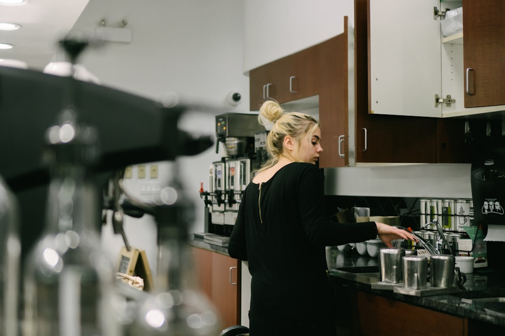 woman making coffee in the kitchen