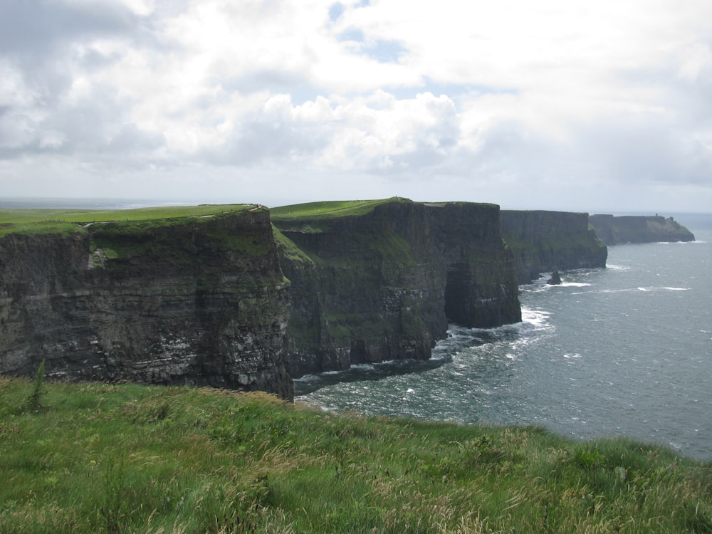 brown mountain cliff fronting the sea