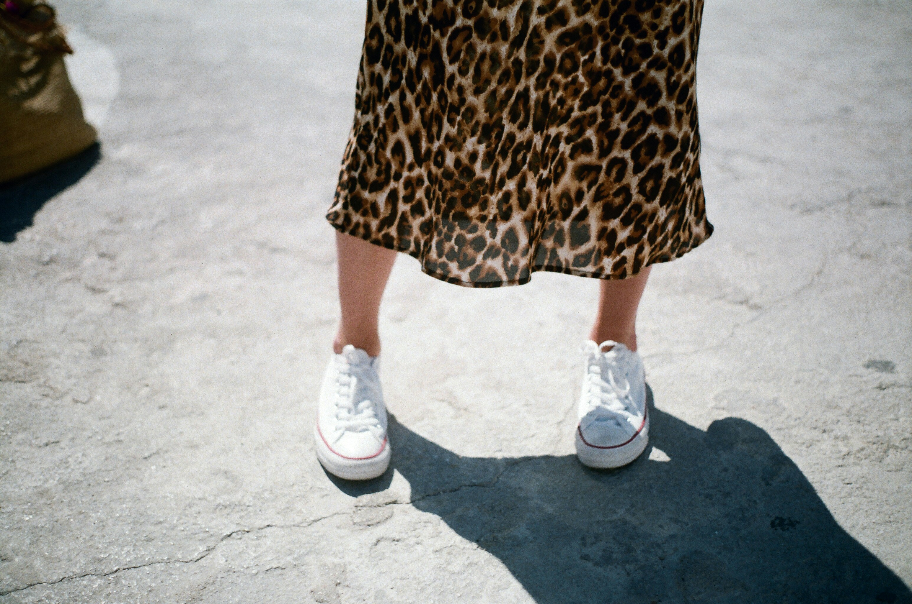 woman wearing white low-top sneakers