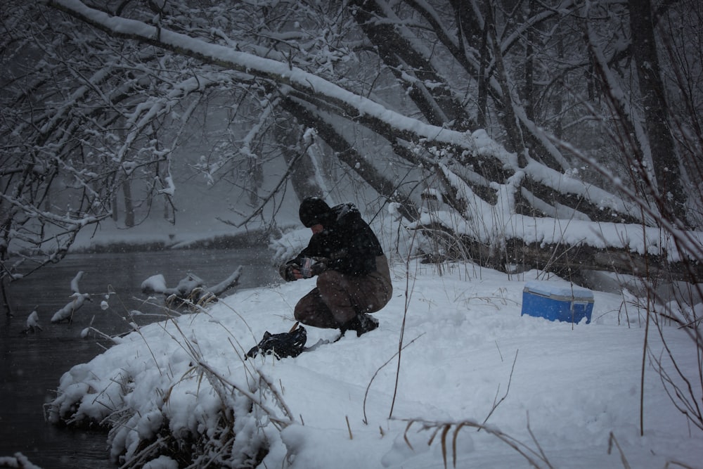 shallow focus photo of person near body of water