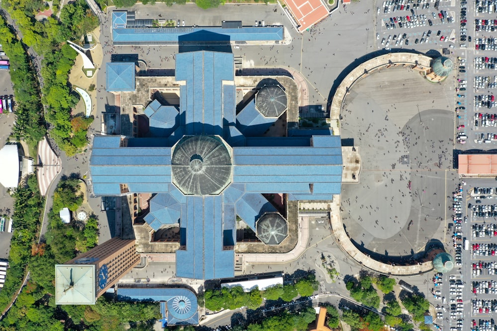 an aerial view of a large blue building