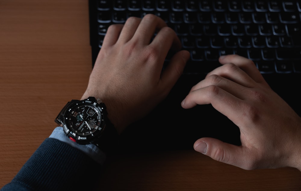 person using black computer keyboard