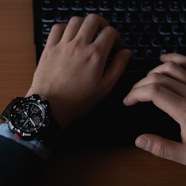 person using black computer keyboard