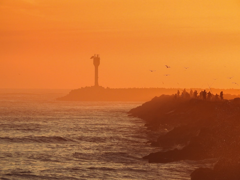 lighthouse facing ocean