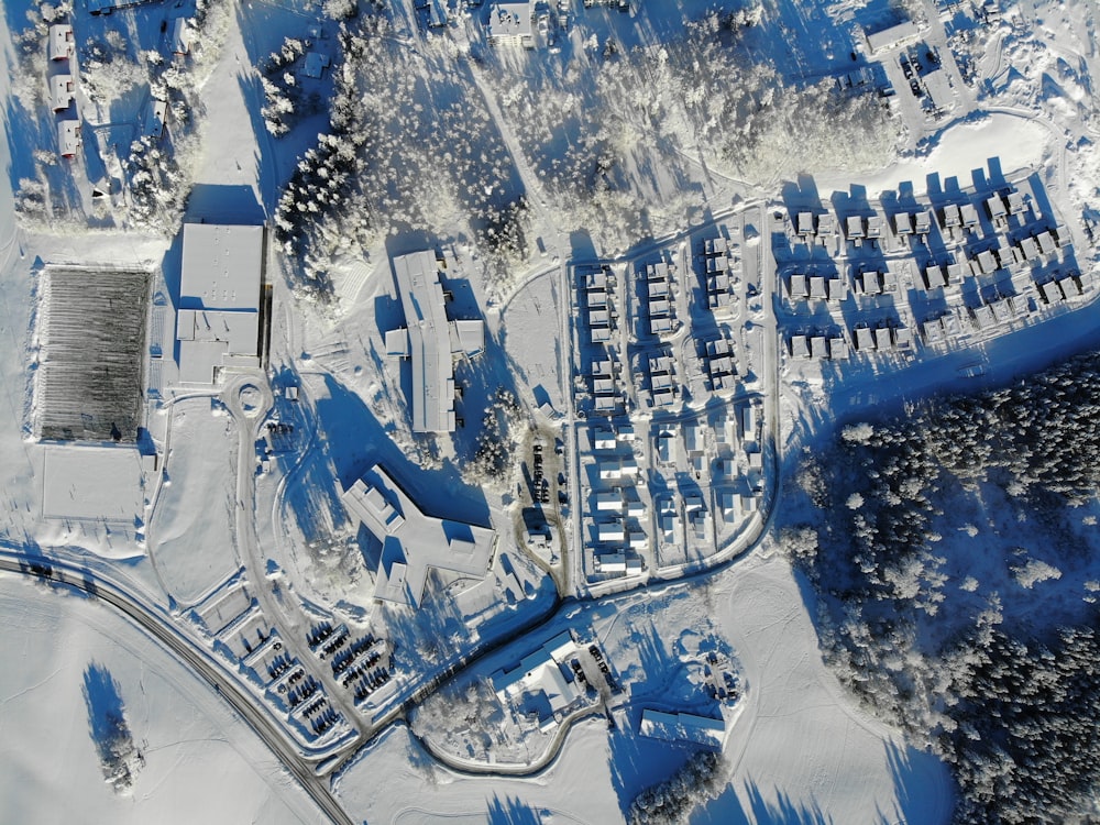 an aerial view of a snow covered village