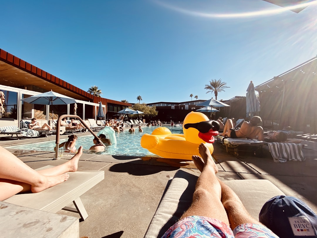 man and woman near pool, Enjoying a day by the pool in a Palm Springs resort.