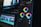A close-up view of a digital video editing software interface, focusing on color grading tools. Three color wheels labeled Midtones, Shadows, and Highlights are prominent, with sliders for adjusting color balance. The background shows a blurred timeline with video and audio tracks, indicating an ongoing editing process.