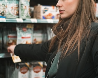 woman standing infront of shelf