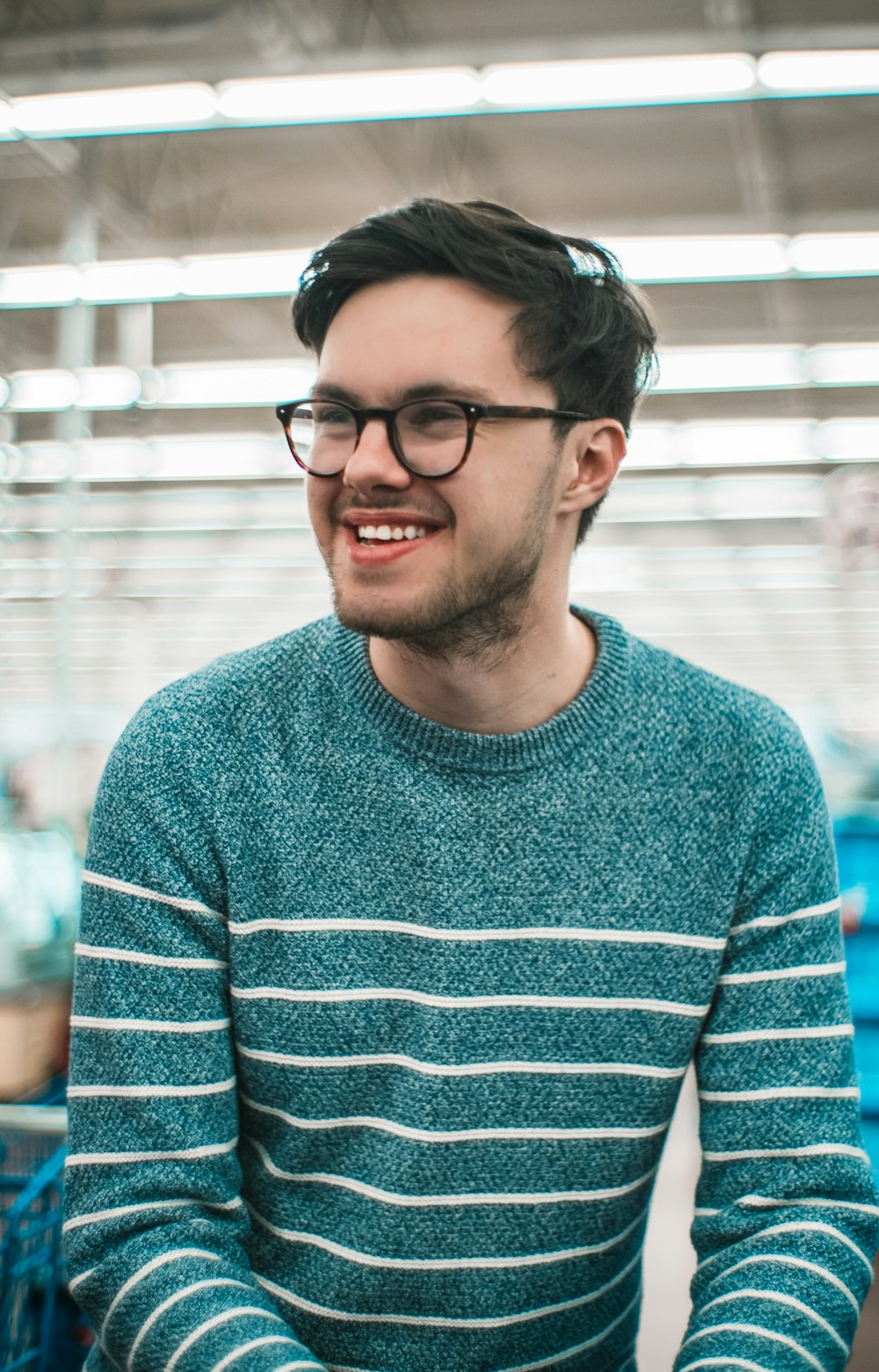 man wearing green and white striped long-sleeved sweatshirt