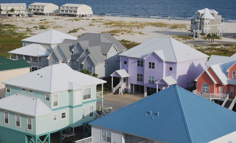 assorted-color houses near seashore