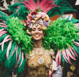 a woman in a green and pink carnival costume