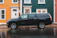 black Cadillac SUV beside road