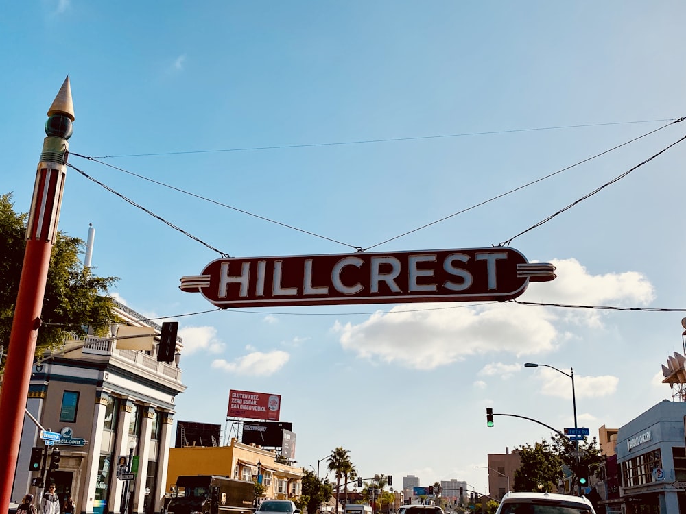 Hillcrest signage under blue cloudy sky