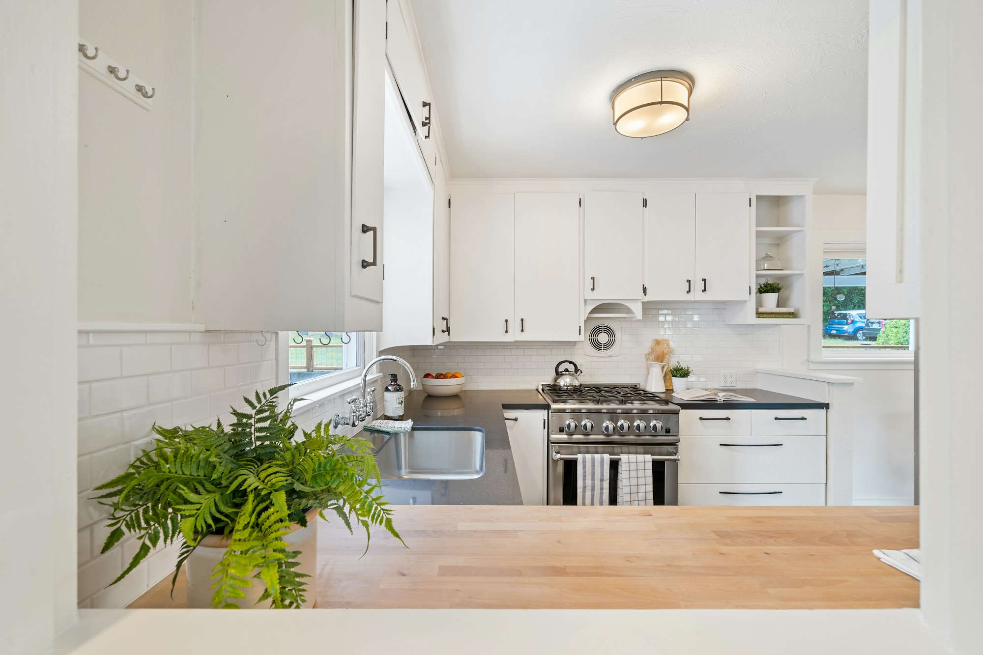 Kitchen with white-painted wooden cupboards 