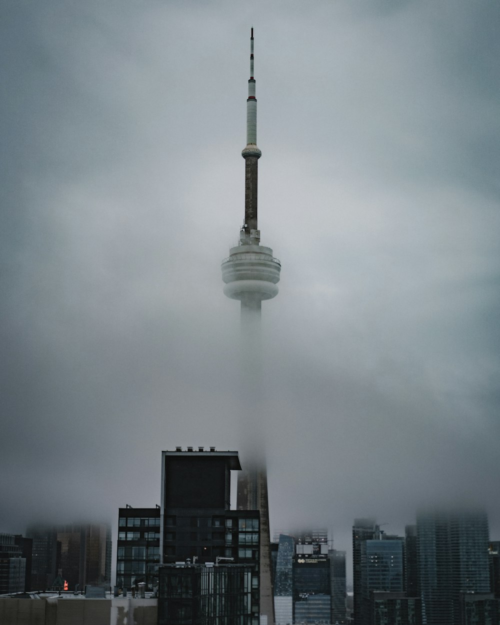 a very tall building with a very tall spire sticking out of it's side