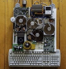 circuit board with iPod Classics beside white computer keyboard
