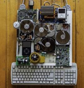 circuit board with iPod Classics beside white computer keyboard