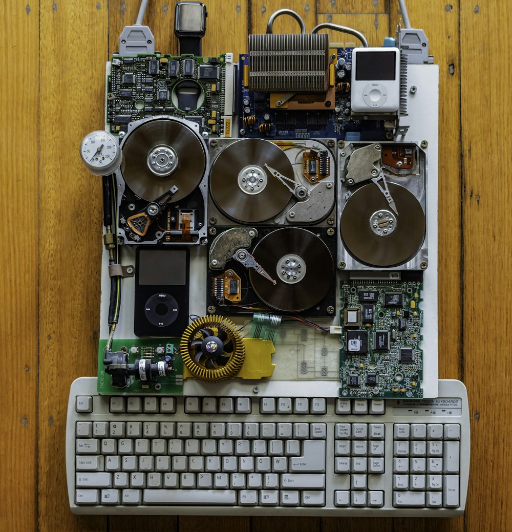 circuit board with iPod Classics beside white computer keyboard
