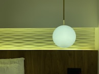 Modern bedroom featuring sleek wallpanel kisi-kisi in natural beige tones