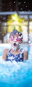 girl swims on swimming pool