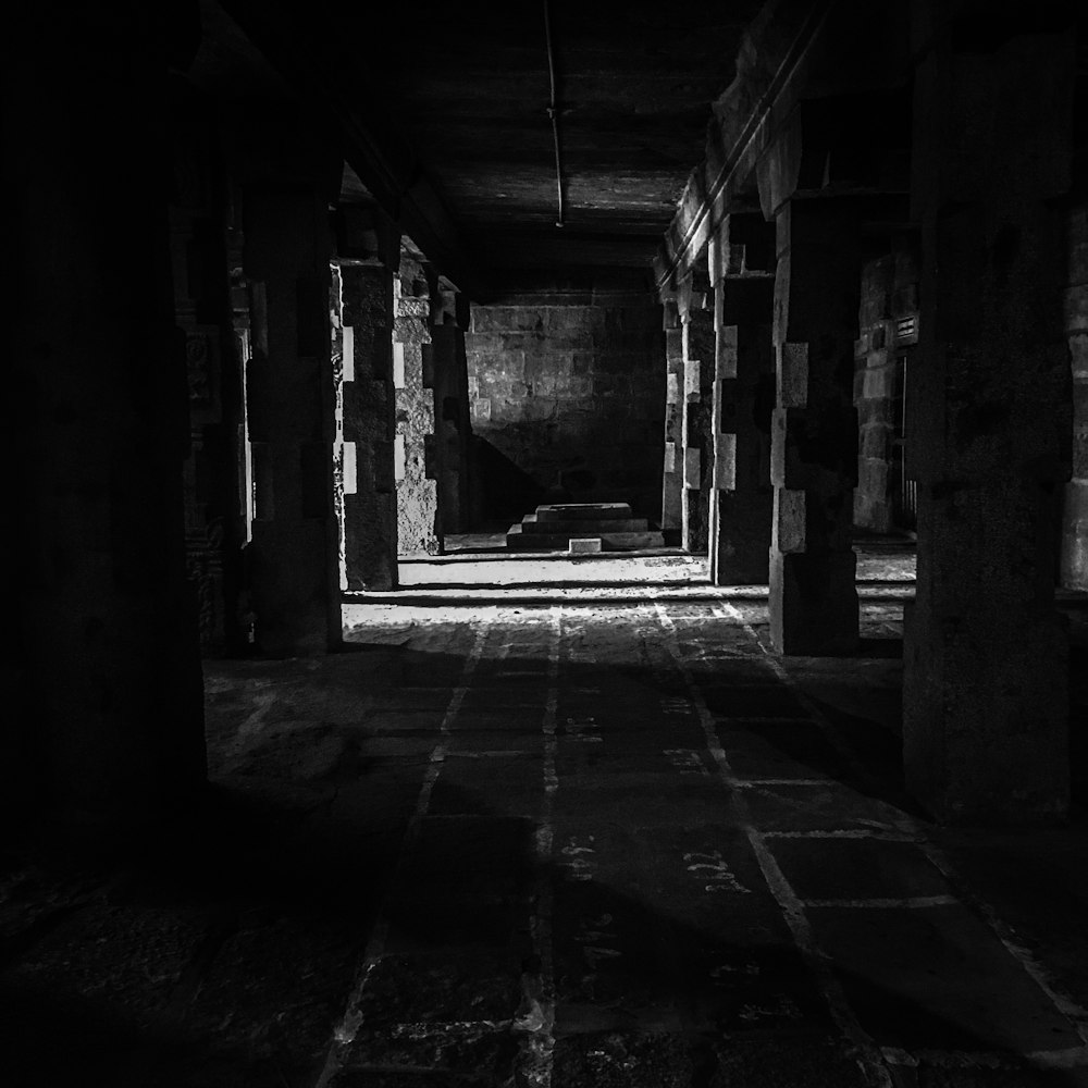 grayscale photography of underground tunnel