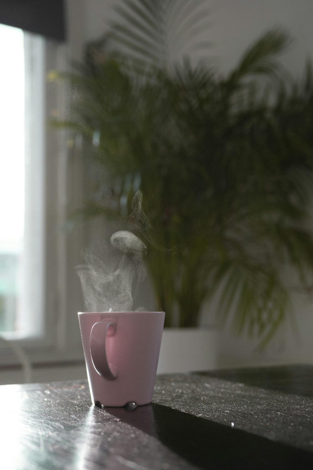 pink mug on black table