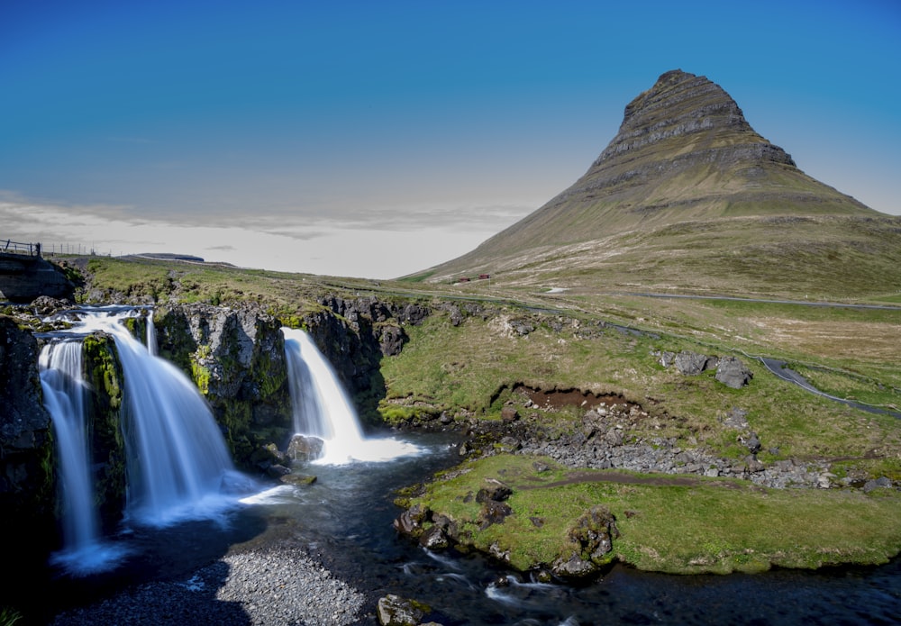 waterfalls under blue sky