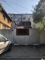 Wide shot of a residential building with an automated electric gate.