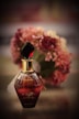 red and gold glass perfume bottle