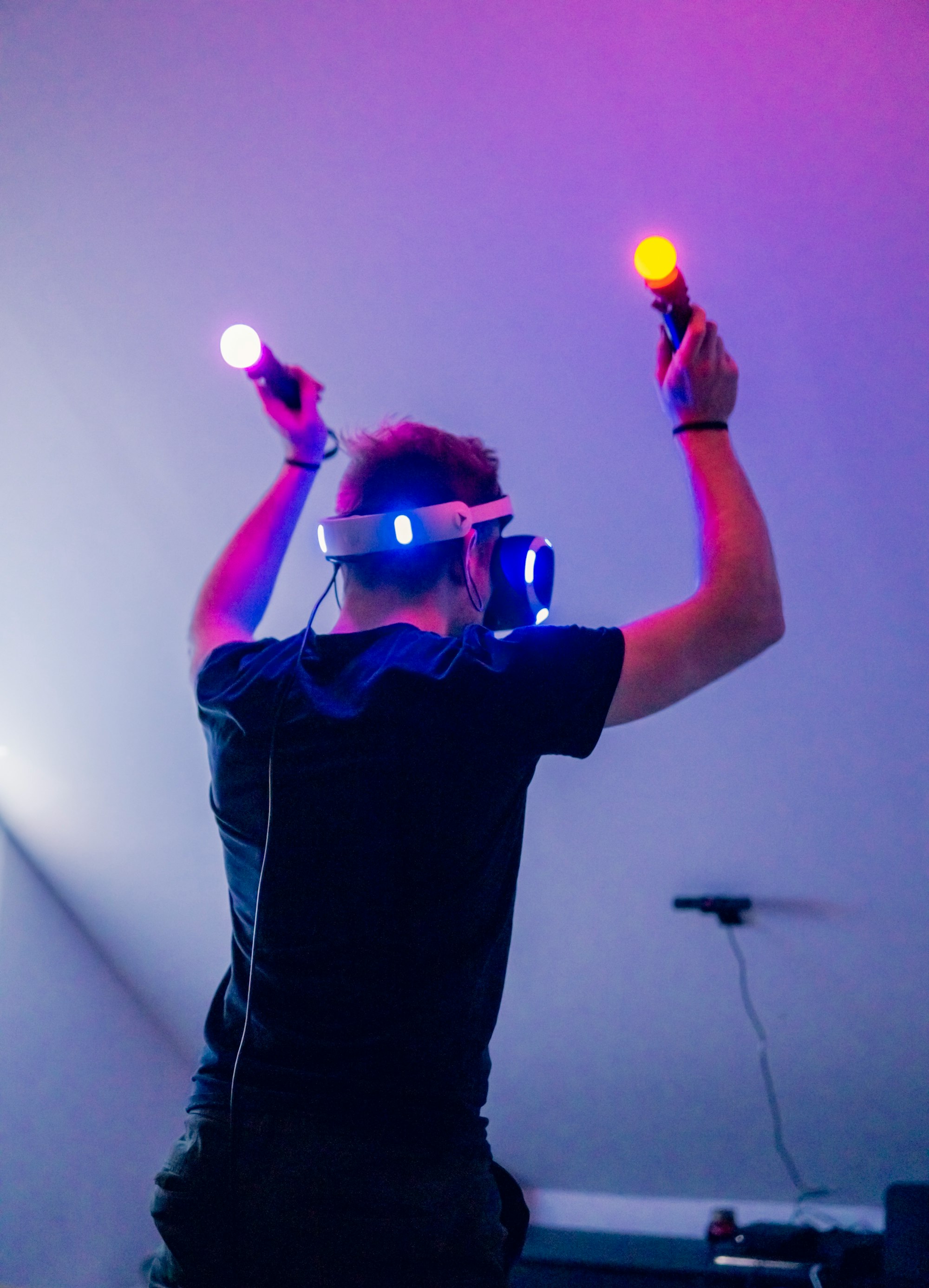 Guy playing Beatsaber on Playstation VR