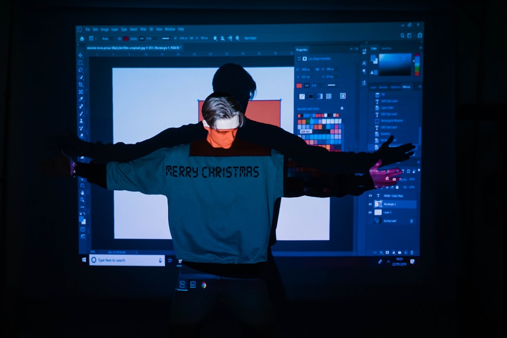 man in Merry Christmas sweatshirt