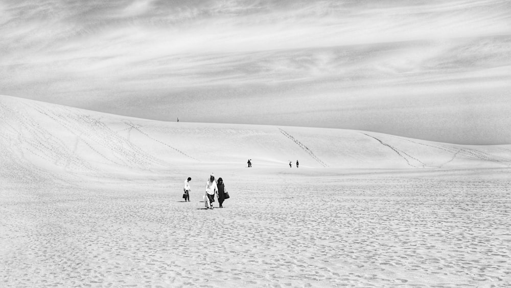 person walking on the sand field