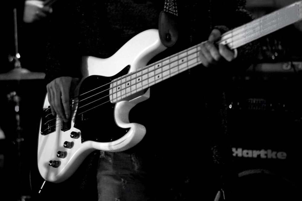 man playing bass electric guitar